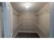 An organized walk-in closet featuring adjustable shelving for optimal storage at 170 Shoal Park Dr, Mcdonough, GA 30252