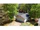 Aerial view showcasing the layout of this home with a two-car garage and landscaping at 455 Tyson Cir, Roswell, GA 30076