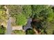 Aerial image showing the home's position on the lot and surrounding mature trees at 455 Tyson Cir, Roswell, GA 30076