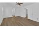 Bright bedroom features hardwood floors, natural light, and a ceiling fan at 455 Tyson Cir, Roswell, GA 30076