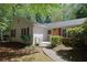 Exterior shot of the home's front entrance, walkway, and landscaping at 455 Tyson Cir, Roswell, GA 30076