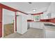 Cozy kitchen with white cabinets, tiled floors, and a stainless steel dishwasher at 455 Tyson Cir, Roswell, GA 30076