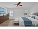 Comfortable main bedroom with ceiling fan, wood floors, and natural light at 455 Tyson Cir, Roswell, GA 30076