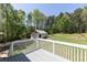 View from deck featuring large backyard, outbuilding and mature trees at 4960 Old Yorkville Rd, Dallas, GA 30157