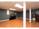 Finished basement space with tile flooring, offering versatility for entertainment and relaxation at 4960 Old Yorkville Rd, Dallas, GA 30157