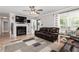 Cozy living room featuring a fireplace, plush couches, and lots of natural light at 4960 Old Yorkville Rd, Dallas, GA 30157