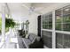 Inviting porch with plush seating and picturesque views through large windows at 4960 Old Yorkville Rd, Dallas, GA 30157