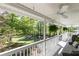 View from covered porch showcasing the manicured yard, flowering tree, and a glimpse of the long driveway at 4960 Old Yorkville Rd, Dallas, GA 30157