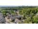 Community view showcasing residential buildings surrounded by dense forest and skyline in the distance at 2116 Gorman Se Grv, Atlanta, GA 30316