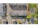 Aerial view displays orderly townhome arrangement amidst lush trees and a well-planned community layout at 2116 Gorman Se Grv, Atlanta, GA 30316