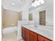 Elegant bathroom featuring a tiled shower, bathtub, and a spacious vanity with double sinks at 2116 Gorman Se Grv, Atlanta, GA 30316