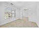 Bright bedroom features a large window and neutral carpet, offering a serene and comfortable space at 2116 Gorman Se Grv, Atlanta, GA 30316