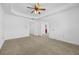 Spacious bedroom featuring plush carpet, a ceiling fan, and multiple entry ways at 2116 Gorman Se Grv, Atlanta, GA 30316