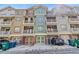 Townhome exterior showcasing brick facade, multiple balconies, and garage doors at 2116 Gorman Se Grv, Atlanta, GA 30316