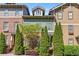 Attractive townhome exterior with brick and siding, complemented by mature landscaping and a blue sky at 2116 Gorman Se Grv, Atlanta, GA 30316