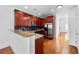 Updated kitchen features stainless appliances, tile backsplash and a breakfast bar for casual dining at 2116 Gorman Se Grv, Atlanta, GA 30316