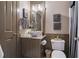 Stylish bathroom featuring modern vessel sink, granite countertop, and decorative wall art at 295 Sagamore Nw Cv, Sugar Hill, GA 30518