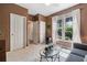 Cozy bedroom featuring neutral carpeting, natural light, and ample closet space at 295 Sagamore Nw Cv, Sugar Hill, GA 30518