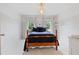Bright bedroom with two windows and neutral walls at 295 Sagamore Nw Cv, Sugar Hill, GA 30518