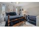 Bright bedroom with a large bed, crib, and natural light, creating a cozy and functional space at 295 Sagamore Nw Cv, Sugar Hill, GA 30518