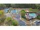 Aerial view of community amenities including pool, tennis courts, and parking for easy access at 295 Sagamore Nw Cv, Sugar Hill, GA 30518
