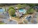 Overhead shot of the community clubhouse, pool, spa, and ample parking at 295 Sagamore Nw Cv, Sugar Hill, GA 30518