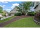 Beautiful home with an attached garage, lush landscaping, and a well-manicured lawn at 295 Sagamore Nw Cv, Sugar Hill, GA 30518