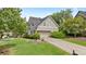 Beautiful home featuring manicured lawns, a two-car garage and detailed landscaping at 295 Sagamore Nw Cv, Sugar Hill, GA 30518
