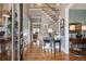 Elegant foyer showcasing hardwood floors, staircase, and views into other rooms, creating an inviting entrance at 295 Sagamore Nw Cv, Sugar Hill, GA 30518