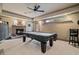 The game room has a fireplace, pool table, and ceiling fan at 295 Sagamore Nw Cv, Sugar Hill, GA 30518