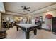 A full-size pool table anchors this game room with a ceiling fan and recessed lighting at 295 Sagamore Nw Cv, Sugar Hill, GA 30518