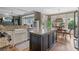 Spacious kitchen with a central island, stainless steel appliances, and access to the dining area at 295 Sagamore Nw Cv, Sugar Hill, GA 30518