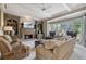 Comfortable living room featuring a fireplace, built-in bookshelves, and plush seating for a cozy atmosphere at 295 Sagamore Nw Cv, Sugar Hill, GA 30518