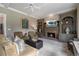 Cozy living room showcases a brick fireplace, built-in bookcases, and comfortable furnishings at 295 Sagamore Nw Cv, Sugar Hill, GA 30518