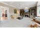 Bright and airy living room featuring a fireplace, built-in cabinets, and an open floor plan at 295 Sagamore Nw Cv, Sugar Hill, GA 30518