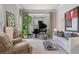 Bright living room with bay window, piano, and comfortable seating at 295 Sagamore Nw Cv, Sugar Hill, GA 30518