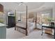 Spacious main bedroom suite featuring trey ceiling, soft natural light, and elegant decor for a relaxing retreat at 295 Sagamore Nw Cv, Sugar Hill, GA 30518