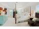 Spacious main bedroom with a four poster bed, sitting area and trey ceiling at 295 Sagamore Nw Cv, Sugar Hill, GA 30518