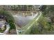 Scenic aerial view of a community pond surrounded by lush greenery and walking trail at 295 Sagamore Nw Cv, Sugar Hill, GA 30518