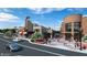 Street view of commercial buildings with a classic theater and people walking on a sidewalk at 295 Sagamore Nw Cv, Sugar Hill, GA 30518
