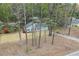 Aerial view of home showcasing the roof, mature trees, and wooded surroundings at 4695 Waters Rd, Woodstock, GA 30188