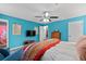 Spacious bedroom boasts bright-colored walls and vibrant furnishings at 4695 Waters Rd, Woodstock, GA 30188