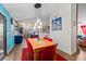 Open-concept dining room showcases unique decor, hardwood floors, and modern lighting at 4695 Waters Rd, Woodstock, GA 30188