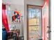 View of the foyer with a vibrant red front door and colorful decor inside at 4695 Waters Rd, Woodstock, GA 30188
