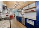 Bright kitchen boasts stainless steel appliances, wooden ceilings and open layout at 4695 Waters Rd, Woodstock, GA 30188