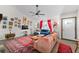 Bright living room with hardwood floors, vibrant decor, and a view of the front door at 4695 Waters Rd, Woodstock, GA 30188