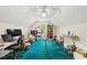 Spacious attic room with a workstation, shelving, and a window at 545 Goldfinch Way, Stockbridge, GA 30281