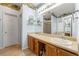 Bathroom with double sink vanity and decorative wallpaper at 545 Goldfinch Way, Stockbridge, GA 30281