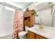 Classic bathroom featuring a shower/tub combo and built-in storage around the toilet at 545 Goldfinch Way, Stockbridge, GA 30281