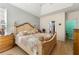 Spacious main bedroom with a tray ceiling and ample natural light at 545 Goldfinch Way, Stockbridge, GA 30281